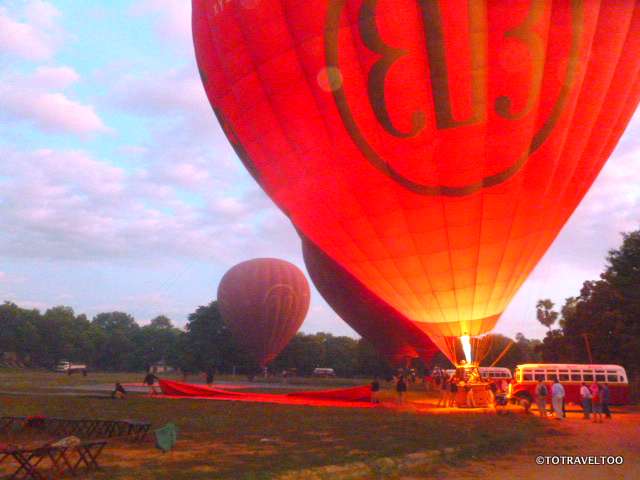 Enflating the balloon at sunrise in Bagan