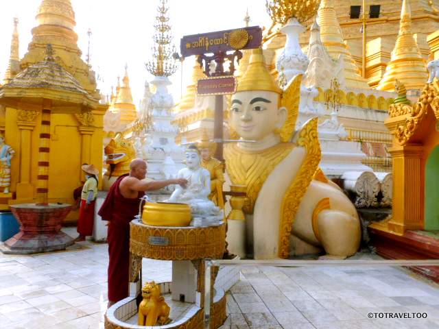 Washing the Buddha Statues at the Tuesday Corner at Shwedagon Pagoda